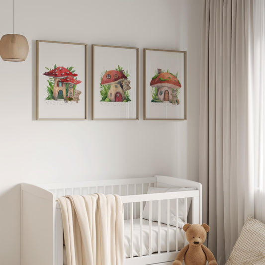 Set of three whimsical mushroom-house storybook nursery prints hung above a white crib in a furnished nursery