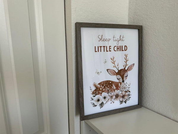 Sleep Tight Little Child deer print framed and displayed in a bright corner nursery nook